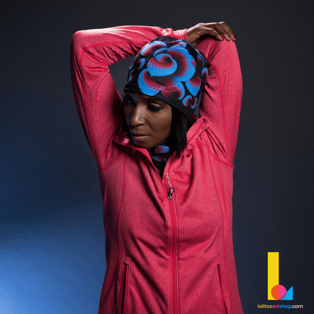 Woman in a red jacket wearing the Blue Flowers beanie and neck warmer