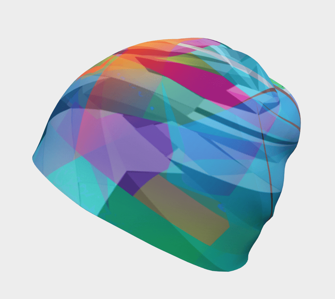 Close-up of a unisex beanie featuring a vibrant abstract 'Fast Triangles' print in blues, greens, and oranges.