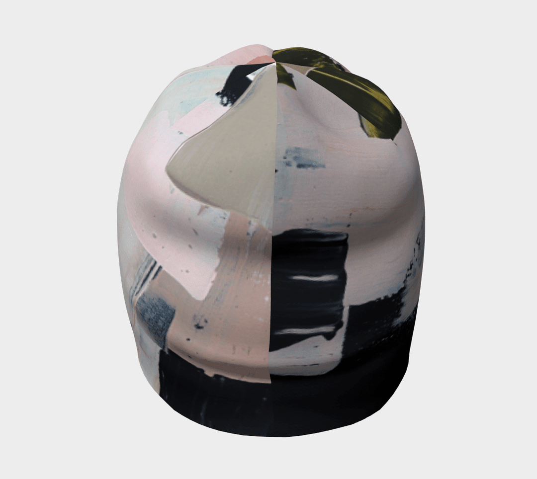 Vue de dessus de la tuque matelassé moderne révélant le motif abstrait avec des sections roses et gris foncé.