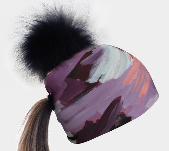 Ponytail Tulips Beanie with a black pompom and a ponytail pulled through the hole.