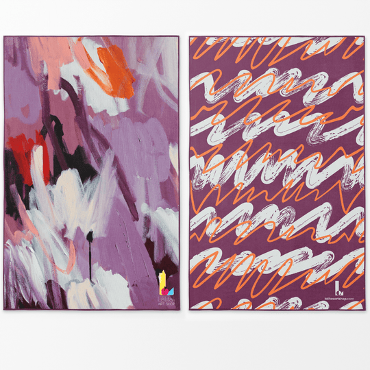 Two sides of the XL Reversible Artistic Towel showing abstract floral and linear wave art.
